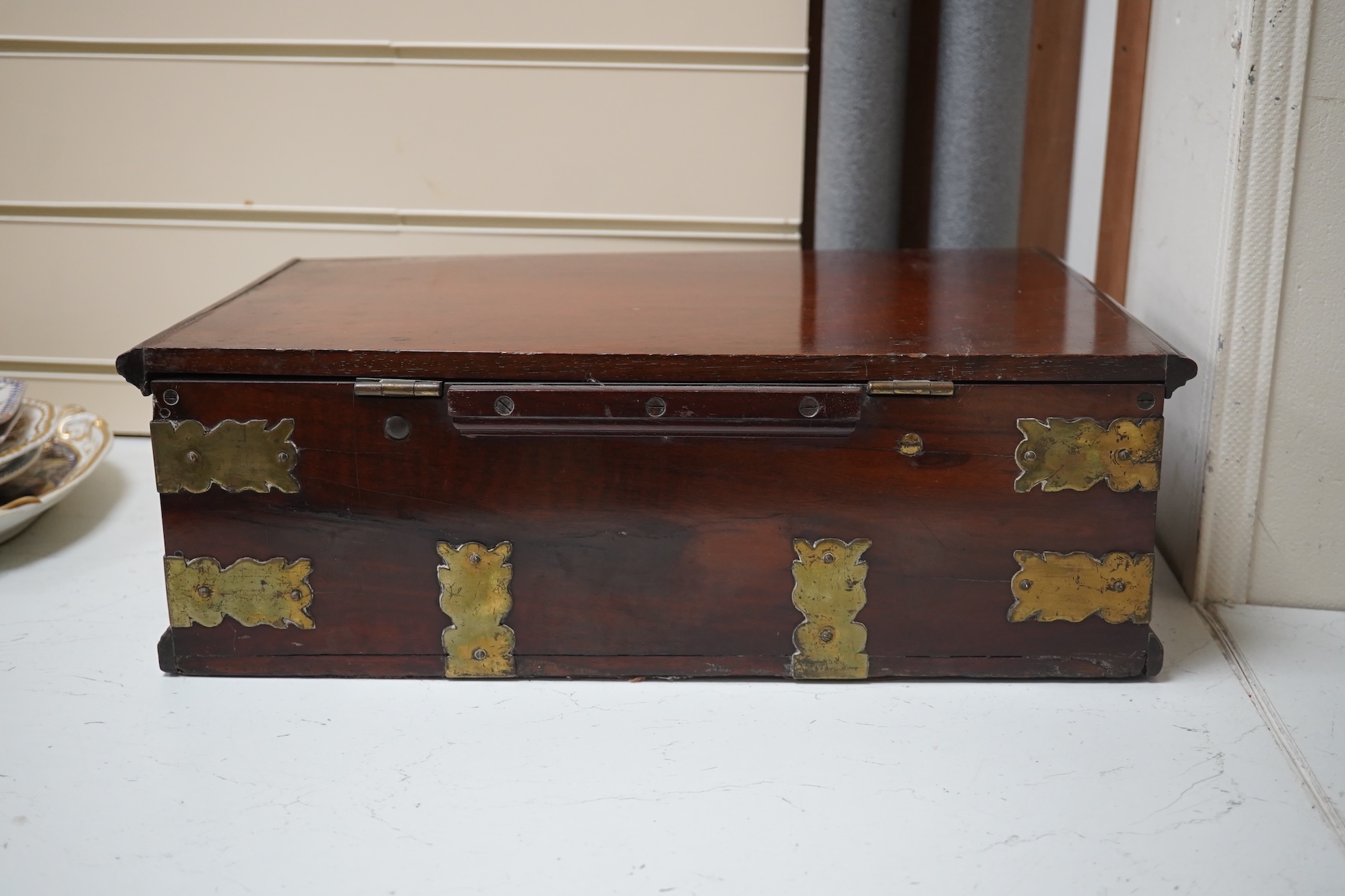 A late 18th century Indo-colonial brass mounted padouk wood casket, 43cm wide. Condition - good for age